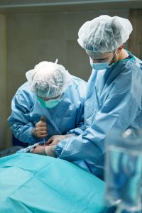 Person in Blue Scrub Suit